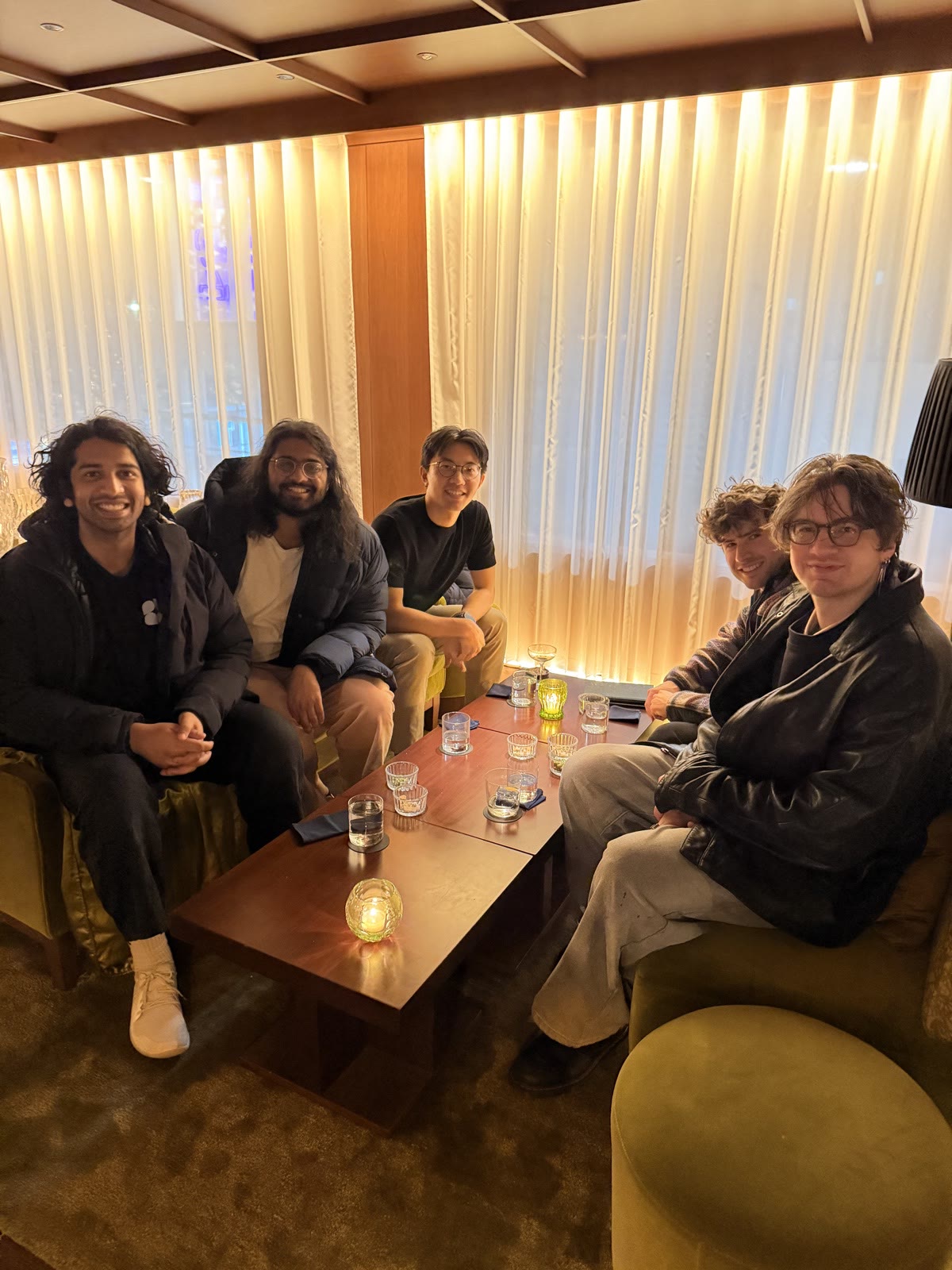 The team in a hotel lounge in the evening