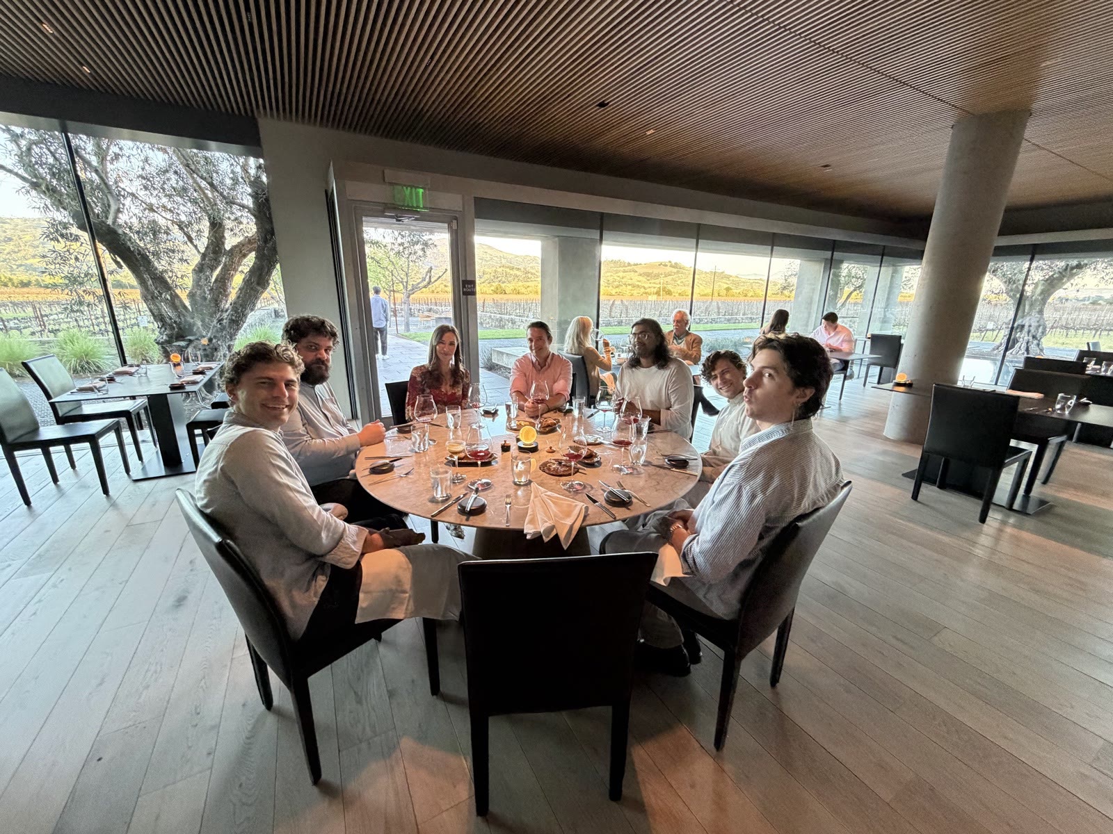 Team lunch at a long table by the windows